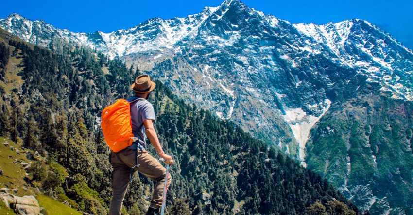 Mountain Trek - Man Wearing Blue Shirt Standing on Cliff While Watching Mountain
