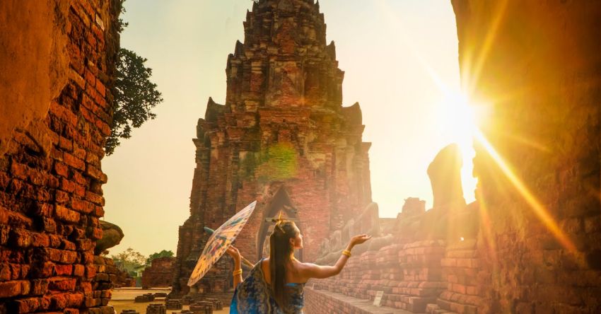 Thailand - Woman Wearing Blue Dress With Umbrella during Sunset