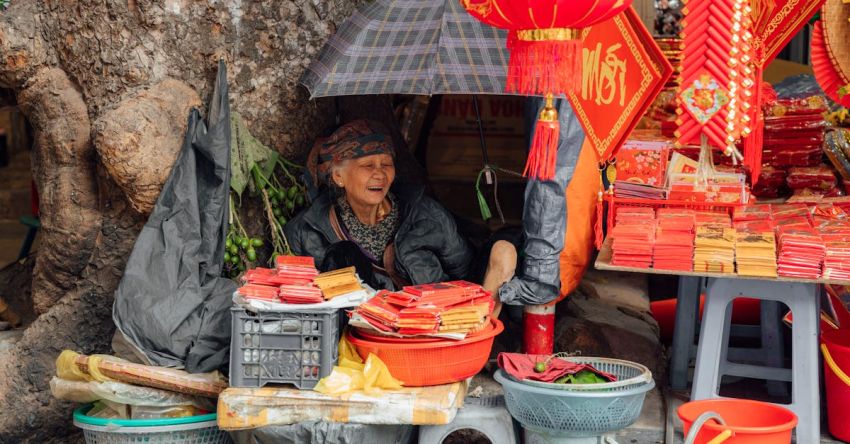 Chinese New Year - A Happy Woman Selling Chinese New Year Decorations
